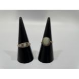 Two 9ct gold opal and diamond dress rings, total weight 5.6 grams.
