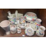 A collection of assorted Poole Pottery items comprising vases, various bowls, a basket with
