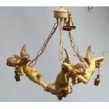 A three-branch figural chandelier with three composite cherubs outstretched each holding a light