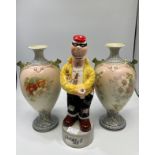 A vintage ceramic ‘Burglar Bill’ musical decanter, 32cm tall, together with a pair of Grimwade’s