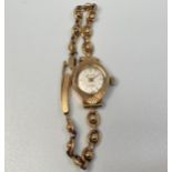 A ladies 9ct gold Accurist wristwatch, the silvered dial with gold batons denoting hours, on 9ct