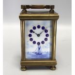 A Swiss brass cased carriage clock with blue and white porcelain panelled sides and dial panel,