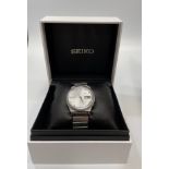 A gents stainless steel Seiko automatic Diashock wristwatch, the silvered crosshair dial with