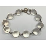 An art deco rock crystal ‘Pools of Light’ bracelet, ten clear spherical beads externally mounted