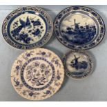 Four assorted 20th century blue and white Delft pottery plates comprising three Koninklijke