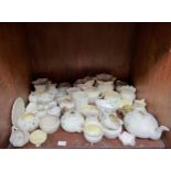 A collection of approximately 40 pieces of assorted Belleek porcelain items including vases, jugs,