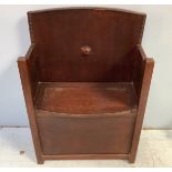 A 19th century stained oak settle, with beaded arched back, lid in seat for storage, raised on