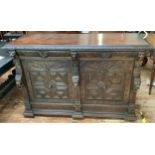 A Victorian carved 'pussy' oak sideboard / cabinet with carved frieze above a pair of drawers with