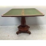 An early Victorian stained mahogany folding card table, of rectangular form, the top enclosing a