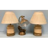 A pair of Laura Ashley cream ‘antiqued’ lamps and shades, overall height 37cm, together with another