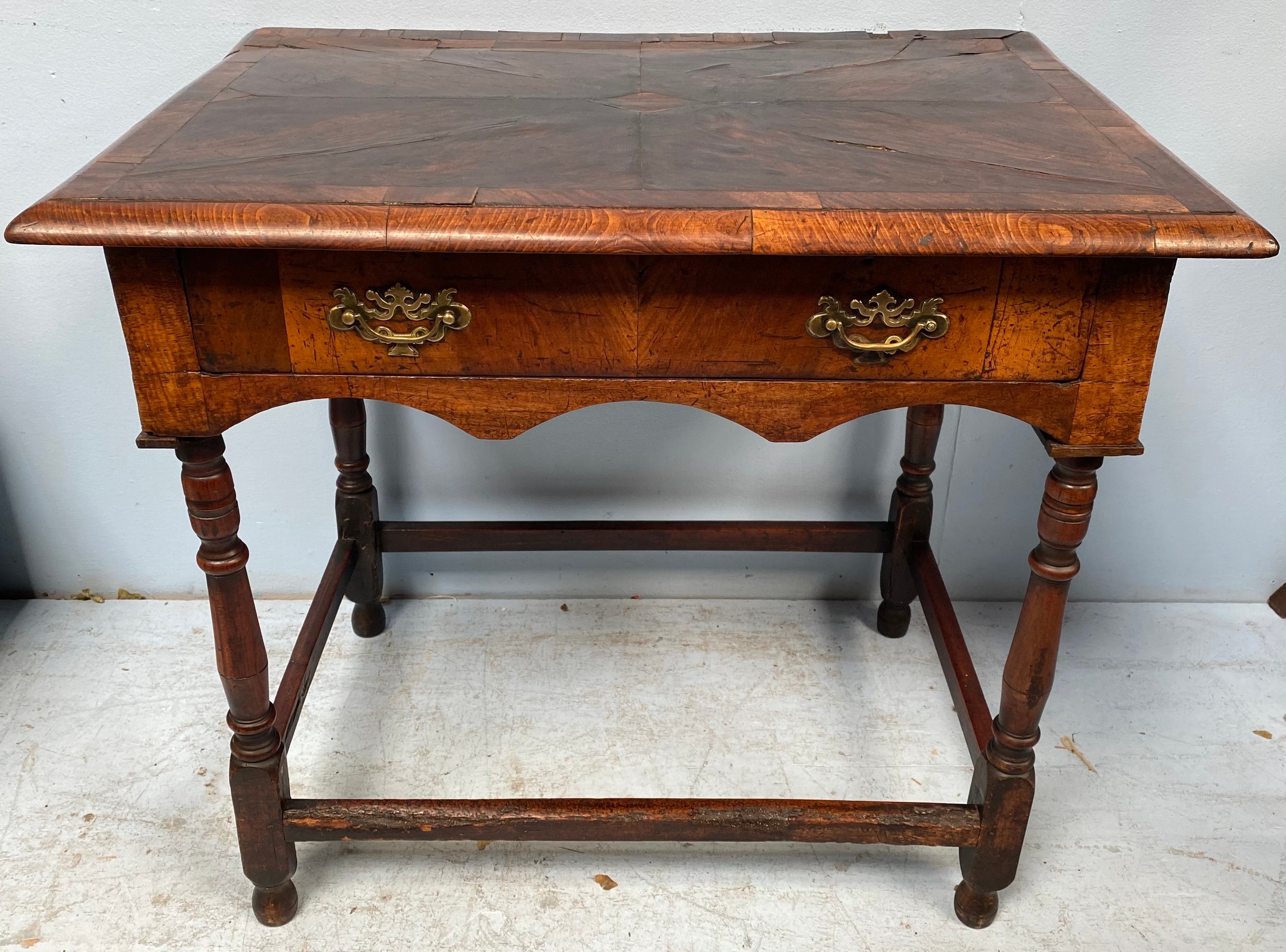 An 18th century Laburnum wood veneered side table with single frieze drawer and brass handles,