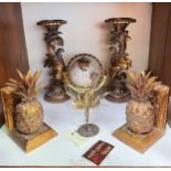 A pair of gilt painted composite pineapple bookends (one af), together with a pair of foliate carved