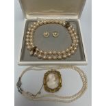 A double-row large Majorcan pearl necklace with gold-plated silver clasp and pendant link with a