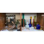 Three shelves of mixed collectables including a rectangular pierced foliate mirror, green paraffin