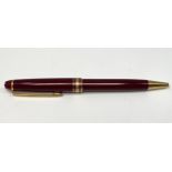 A Montblanc Meisterstuck Pix ballpoint pen, with maroon resin body and gilt mounts, serial no.