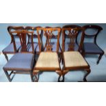Eight assorted dining chairs including a pair of mahogany Chippendale style chairs with pierced