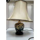 A Moorcroft Pottery lamp in the Bullrush design, of tapering cylindrical form, on stepped,