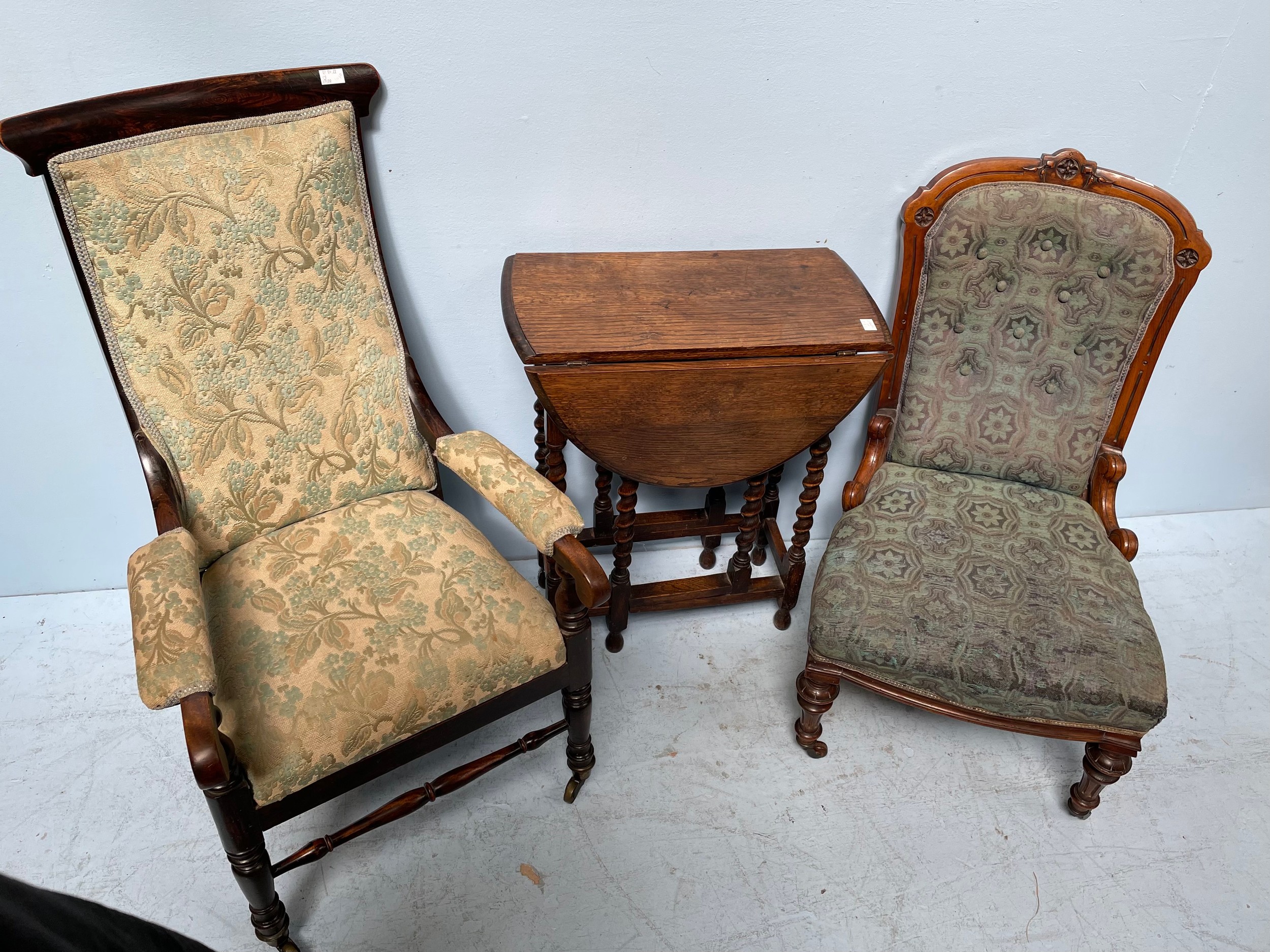 A Victorian upholstered chair with carved and fluted front supports, together with a parlour chair