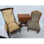 A Victorian upholstered chair with carved and fluted front supports, together with a parlour chair