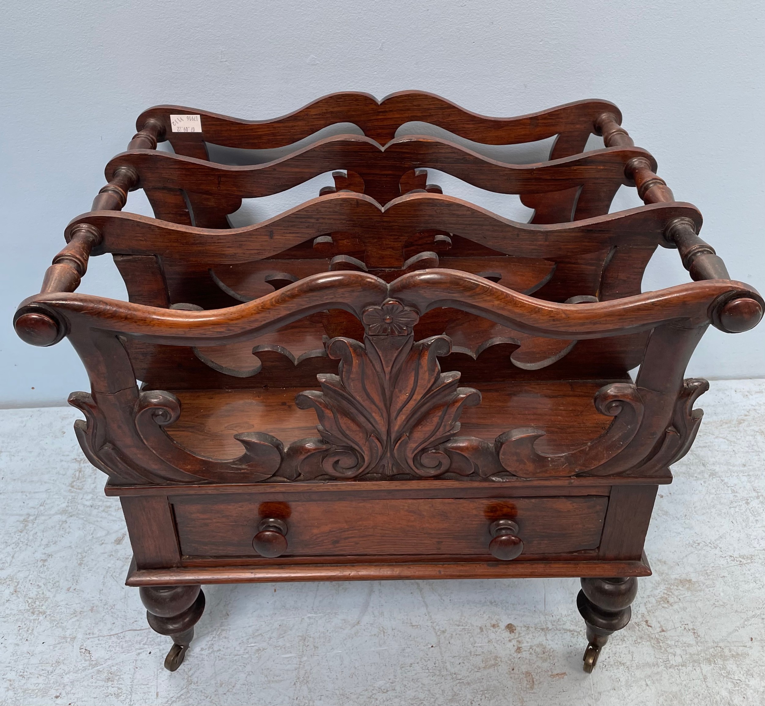 A 19th century rosewood three division Canterbury, with foliate pierced divisions, single drawer,