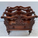 A 19th century rosewood three division Canterbury, with foliate pierced divisions, single drawer,