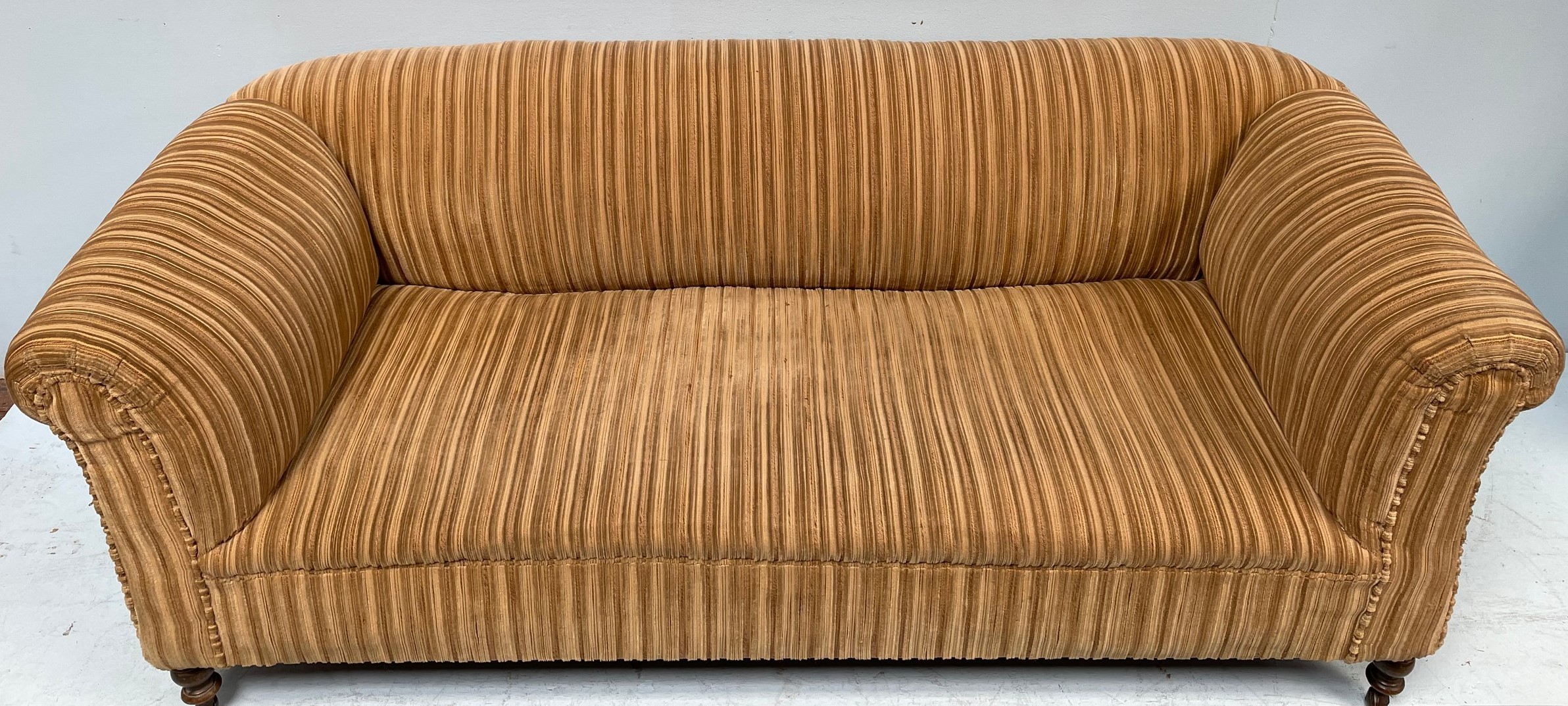 A Chesterfield style sofa with stripy beige and brown upholstery, 190cm wide