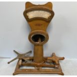 A large ornately cast brass set of shop scales by Henry Pooley & Son Ltd, Birmingham, with glazed