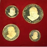 A set of four graduated 18ct gold Commemorative medals in fitted case, prouced in 1965 on the