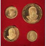 A set of four graduated 18ct gold Commemorative medals in fitted case, prouced in 1965 on the