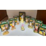 A set of eight Royal Doulton Walt Disney figures, Snow White and the Seven Dwarves, Sleepy, Dopey,
