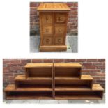 A pair of modern walnut bookcases with two shelves and stepped opposing top sections, 106cm wide,