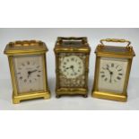 Three brass cased carriage clocks including a Bayard example with white enamel dial and Roman