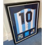 A framed replica Argentina shirt by Le Coq Sportif, bearing the signature of two-time Ballon d’Or