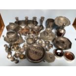 A large quantity of pewter and silver-plated items including candlesticks, Royal Holland decanter,