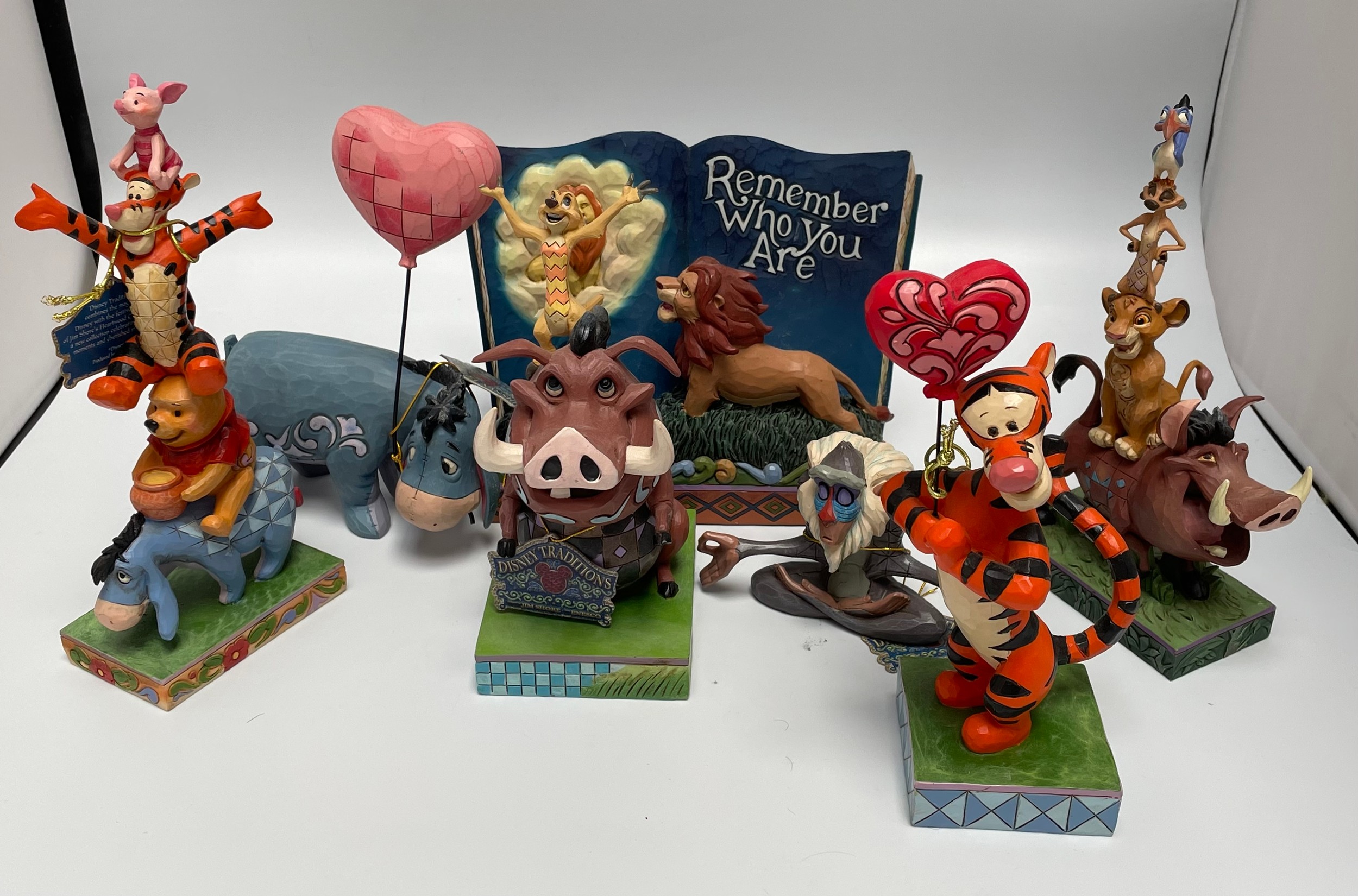 Seven various Disney Showcase Collection figures including four from The Lion King, Tigger, Winnie