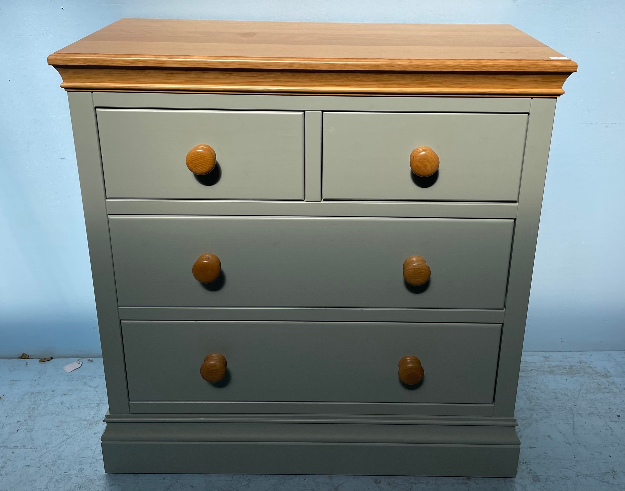 A modern green painted pine chest of two short over three long drawers, 93cm wide