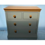 A modern green painted pine chest of two short over three long drawers, 93cm wide