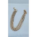 A solid 9ct yellow gold curb link chain, weighing 22.2 grams, 18 inches in length.