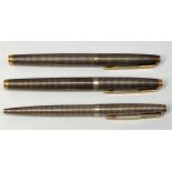 Two Parker 75 Cisele fountain pens with silver caps and barrels and 14ct gold nibs, together with
