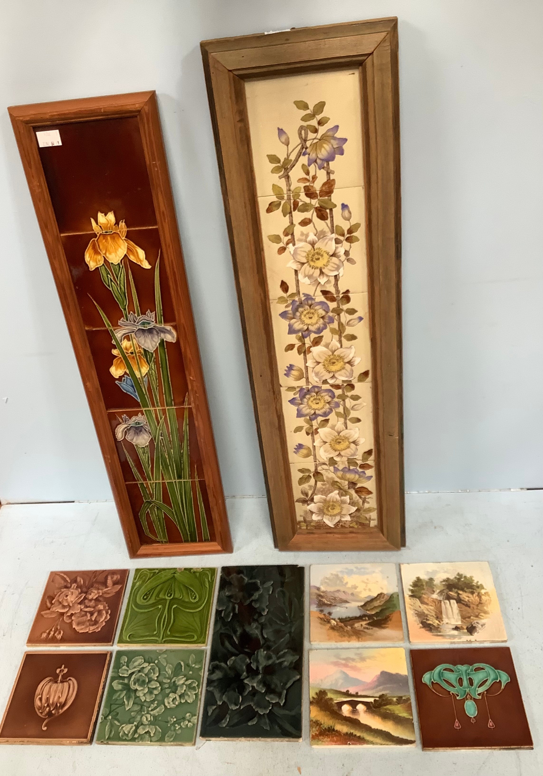 A pair of framed tile panels, one Art Nouveau fireside set of four tiles making up flowers with tall