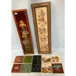 A pair of framed tile panels, one Art Nouveau fireside set of four tiles making up flowers with tall