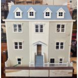 A large Georgian style dolls house over four floors plus a roof terrace, 110cm high x 98cm wide,