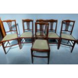 A set of six Edwardian mahogany standard chairs, with inlaid backs and pale green upholstered drop