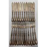 A set of twelve 800 grade silver fish knives and forks with foliate embossed handles, weight approx.