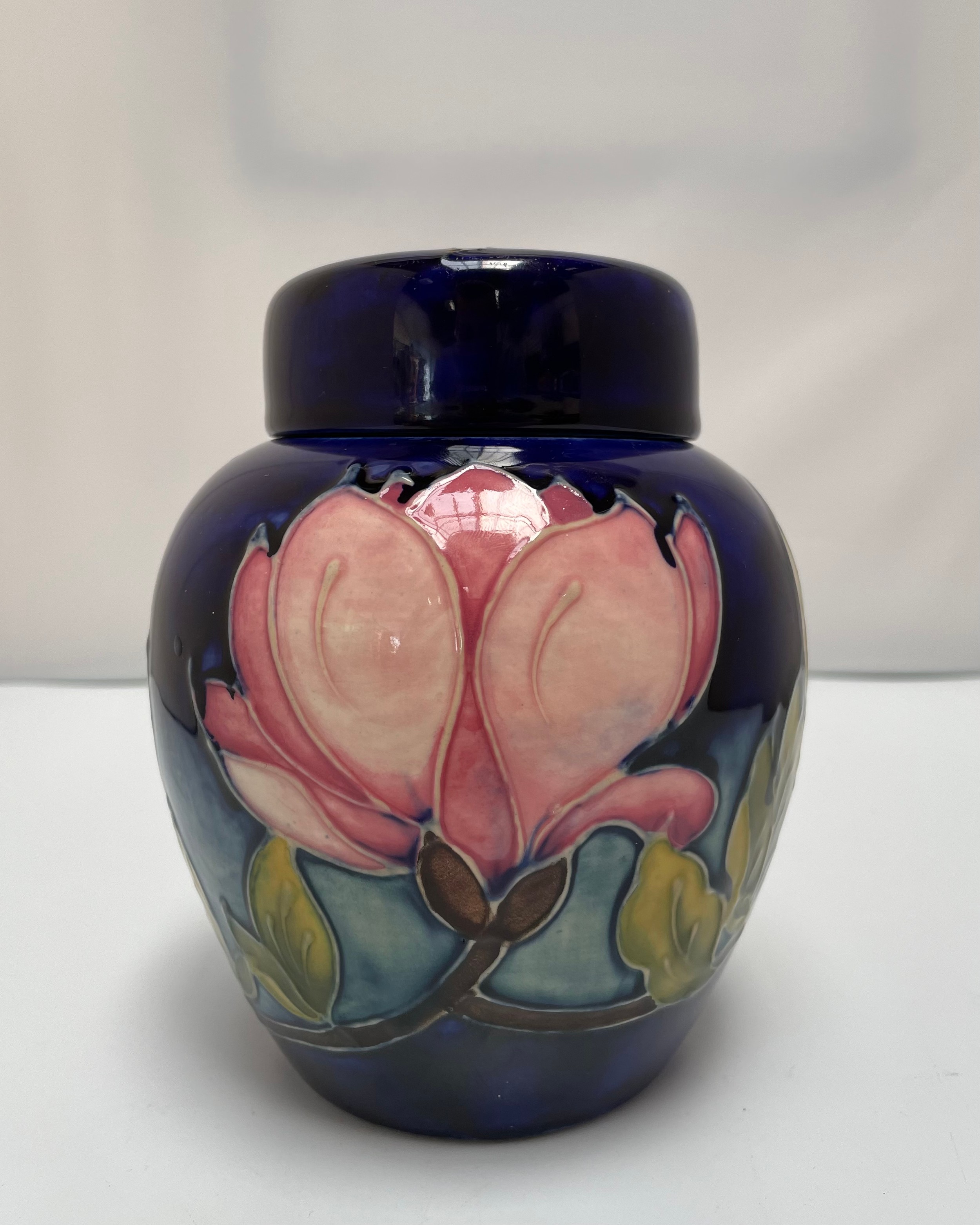 A Moorcroft Pottery ginger jar and cover, in the Magnolia pattern, with impressed and painted