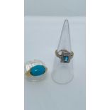 Two 9ct gold dress rings, one set with an oval cabochon turquoise stone, the other set with a