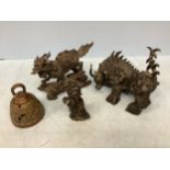 Three various Chinese bronze figures including a Kylin, horned beast of burden and a ram holding a