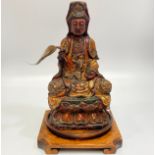 An 17th/18th century finely carved wood, gesso and polychrome seated Bodhisattva/Buddha, modelled