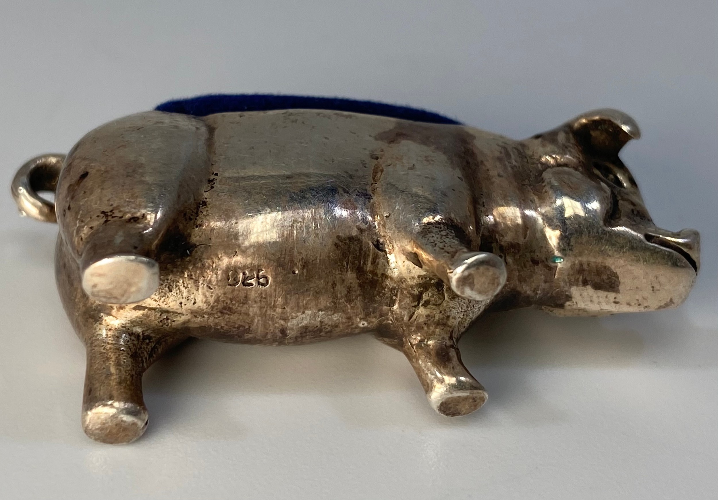 A silver pin cushion modelled as a pig with curled tail, stamped ‘925’, approximately 4cm long - Image 2 of 3