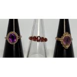 A 9ct gold graduated five-stone garnet ring, together with two various 9ct gold solitaire amethyst